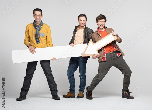 Photo: Three man with arrow Three man with arrow