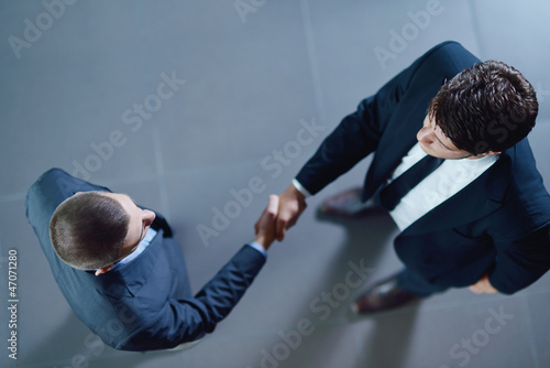Photo: business people making deal business people making deal