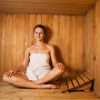 Young woman relaxing in a sauna