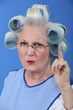 Old woman waving her finger in disapproval
