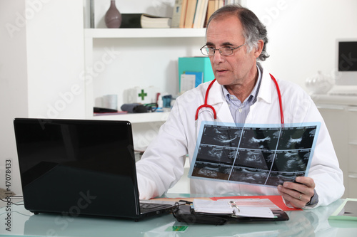 Photo: Doctor with x-ray in hand Doctor with x-ray in hand