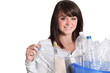 woman gathering bottles