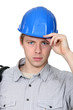 Electrician stood with coil over shoulder