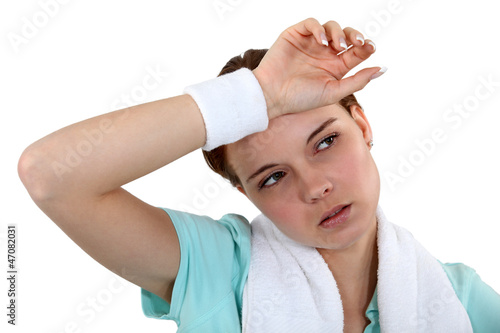 Photo: Woman exhausted after workout Woman exhausted after workout