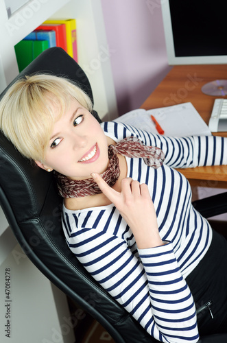 Photo: cheerful girl in the office cheerful girl in the office