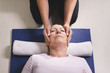 Photo: Young therapist doing reiki therapy to senior woman Young therapist doing reiki therapy to senior woman