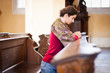 Young woman praying in a church