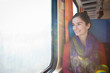 Photo: Portrait of a young woman traveling by train Portrait of a young woman traveling by train