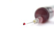 Needle with a drop of blood