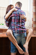 Portrait of a young couple embracing each-other in the kitchen