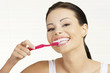 Woman holding tooth brush, isolated
