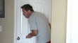 Couple Eavesdropping Against Door