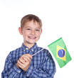 Foto: A little boy with brazilian flag on the white background A little boy with brazilian flag on the white background