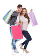 Guy and gal brings shopping bags