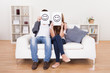 Couple covered faces