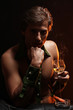 Artistic image of handsome man smoking carrot like a cigar