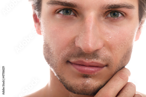 Photo: Charming and handsome man face close up Charming and handsome man face close up