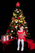Happy little girl with Christmas gifts