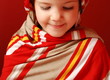 A little girl in tucker