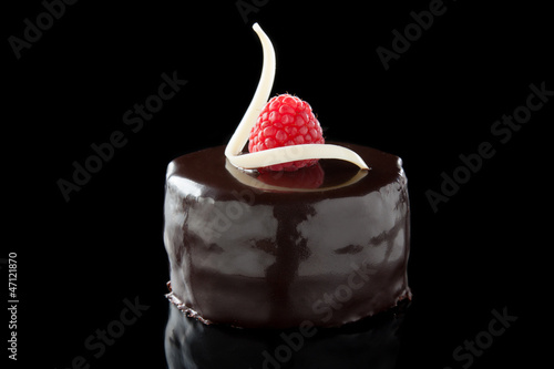 Photo: chocolate cake decorated with raspberries chocolate cake decorated with raspberries