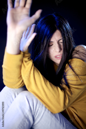 Photo: Beautiful woman scared about domestic violence Beautiful woman scared about domestic violence