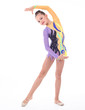Photo: Beautiful flexible girl gymnast over white background Beautiful flexible girl gymnast over white background