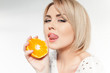 beautiful young and healthy women with yellow tangerines