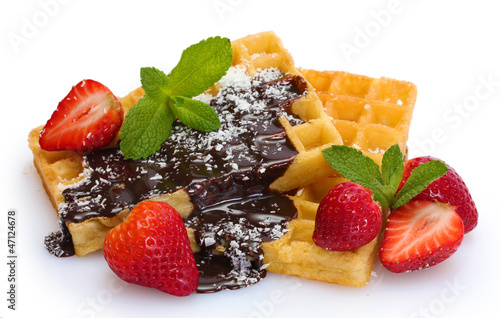 Photo: belgium waffles with strawberries and mint isolated on white belgium waffles with strawberries and mint isolated on white