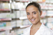 Photo: Portrait of Smiling Woman Pharmacist in Pharmacy Portrait of Smiling Woman Pharmacist in Pharmacy