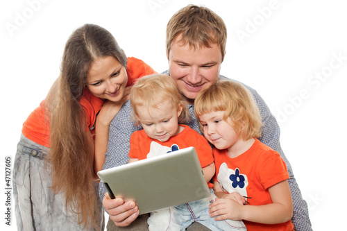 Photo: The family looks the monitor The family looks the monitor