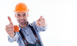 Photo: A builder man holding a key and a paper house. A builder man holding a key and a paper house.