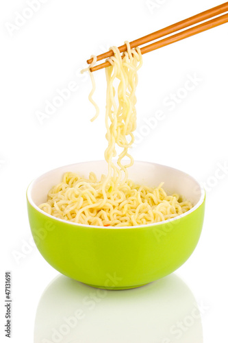 Photo: chopsticks holding asian noodles isolated on white chopsticks holding asian noodles isolated on white