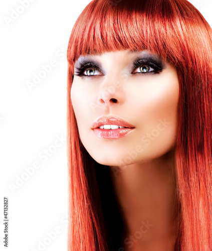 Photo: Red Haired Model Portrait over White Background Red Haired Model Portrait over White Background