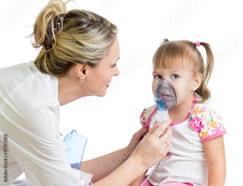 Photo: Doctor holding inhaler mask for kid breathing, hospital Doctor holding inhaler mask for kid breathing, hospital
