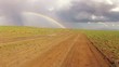 desert driving and rainbow