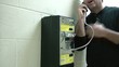 Man Talking on Payphone