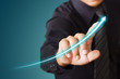 Businessman touching a growth chart