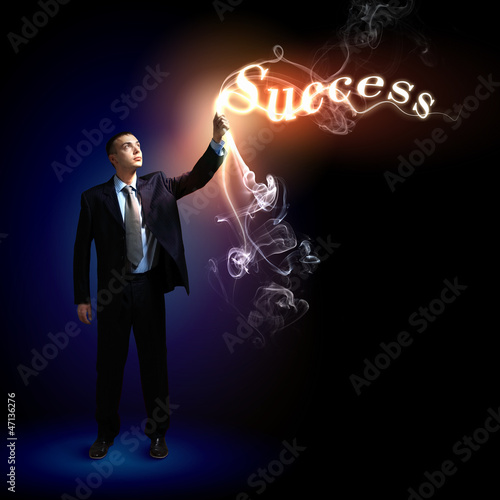 Photo: Businessman with light shining Businessman with light shining