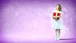 Happy girl opening gift box