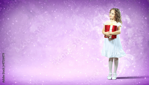 Photo: Happy girl opening gift box Happy girl opening gift box