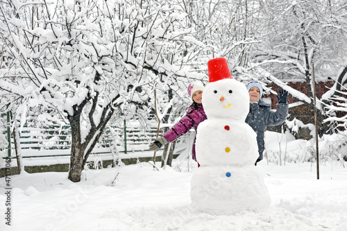 Photo: snowman and kids snowman and kids