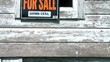 For Sale Sign Irony on Abandoned Building