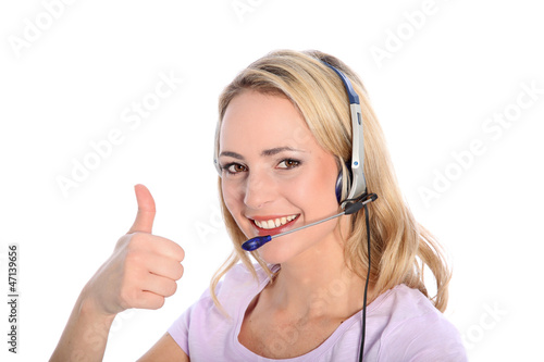 Photo: Happy young call operator or receptionist Happy young call operator or receptionist
