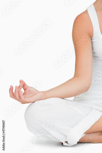 Photo: Woman doing yoga while sitting Woman doing yoga while sitting