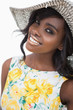 Woman standing wearing a summer hat