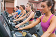 People exercising on exercise bicycles