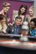Man surrounded by women accepting of loss