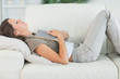 Woman lying on sofa and sleeping deeply