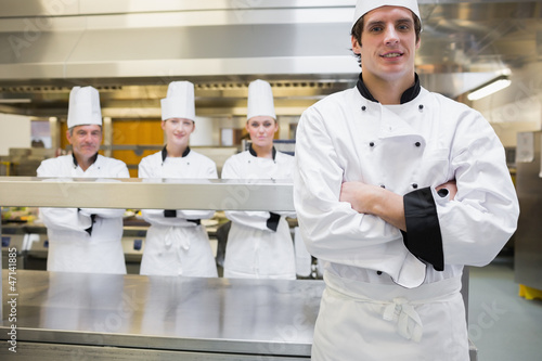 Photo: Male chef standing in kitchen Male chef standing in kitchen