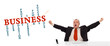 businesman sitting at desk with business word cloud